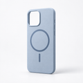 Muted mist blue ultra-thin MagSafe iPhone case on a warm white studio background